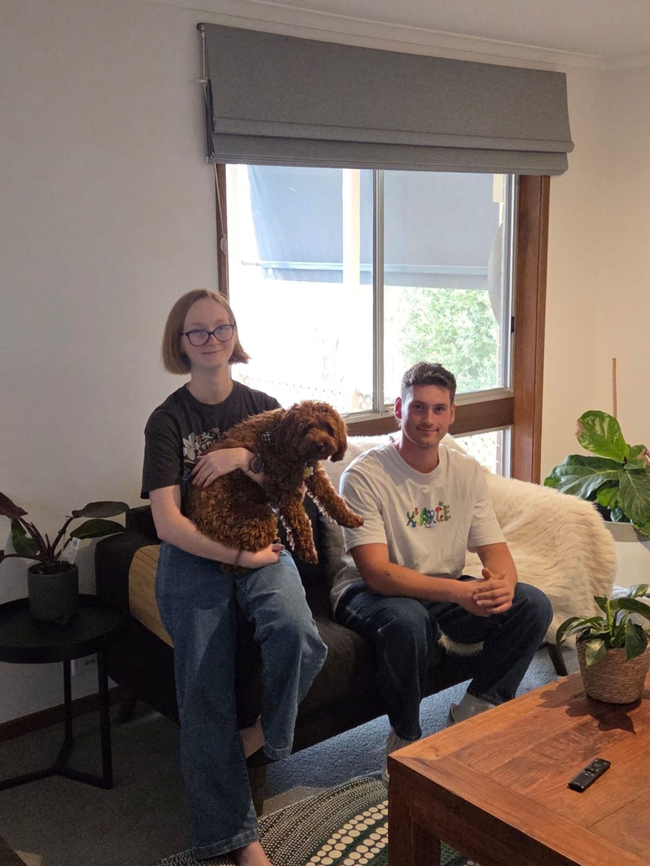 Siblings sitting on couch