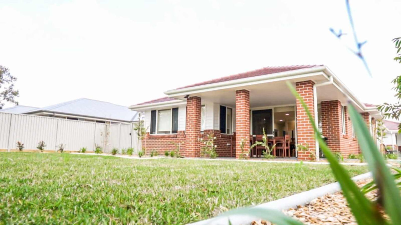 view of house on grass